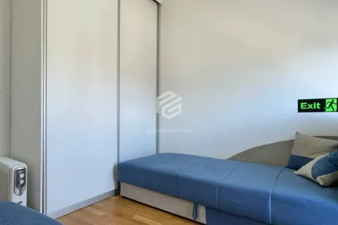 Small bedroom with a bed and a built-in wardrobe. - image 11