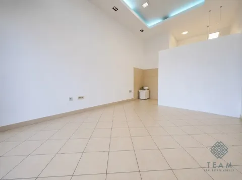 Empty bright room with ceramic floor tiles and a dropped ceiling. - image 2