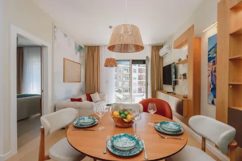 Living room with a dining area and seating set. - image 3