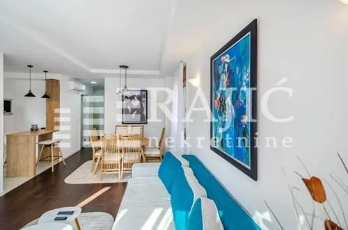 Spacious living room connected to the dining area and kitchen.
