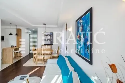 Spacious living room connected to the dining area and kitchen. - image 13