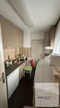 Smaller kitchen with a sink, cabinetry, and kitchen appliances. - image 5