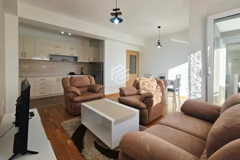 Living room with furniture and a dining area connected to the kitchen. - image 5