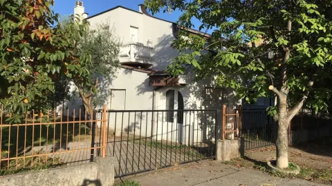 Exterior of a two-story house with a fenced yard. - image 5