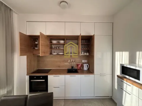 Modern kitchen with white and wooden elements. - image 6