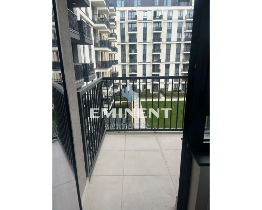 Small balcony with a view of neighboring buildings.