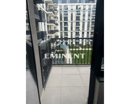 Small balcony with a view of neighboring buildings. - image 14