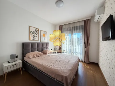 Furnished bedroom with a double bed, nightstand, and terrace access. - image 10