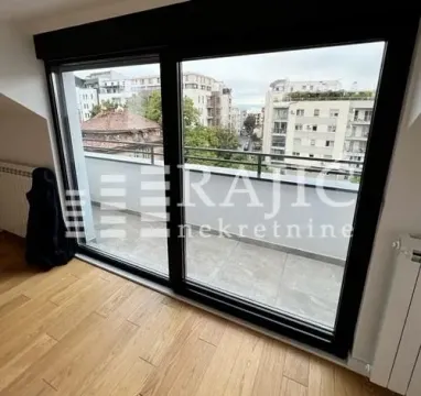 Living room with a large glass door and access to the terrace. - image 4