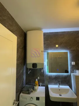 Bathroom with a washbasin, washing machine and a water heater on the wall. - image 10