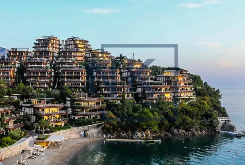 View of the seaside building complex with a beach.