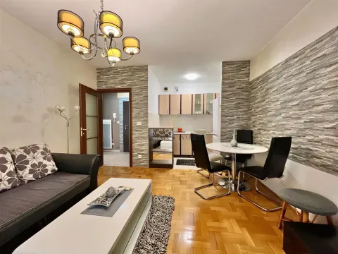 Living room with dining area and an open view of the kitchen. - image 3