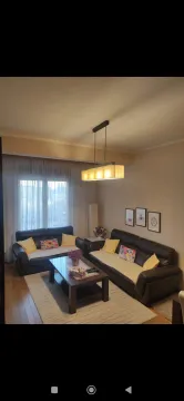 Comfortable living room with sofa set and coffee table. - image 5