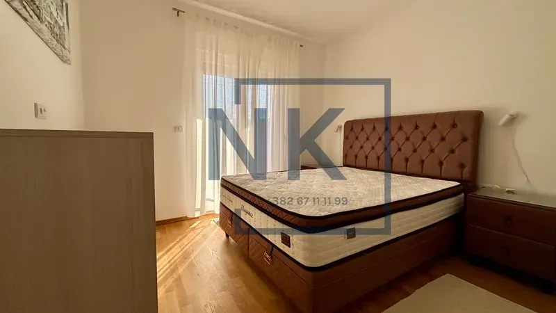 Bedroom with a double bed and nightstands.