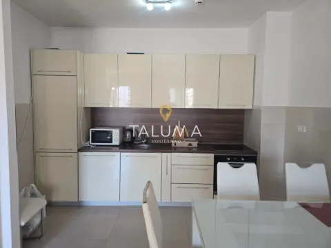 Kitchen with light cabinets and built-in appliances. - image 4