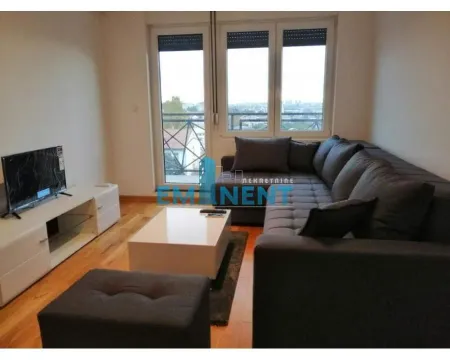 Living room with a sectional sofa, TV, and access to the terrace. - image 13
