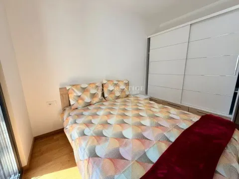 Furnished bedroom with a double bed and built-in wardrobe. - image 7