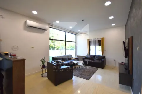Spacious living room with seating set and large windows. - image 5