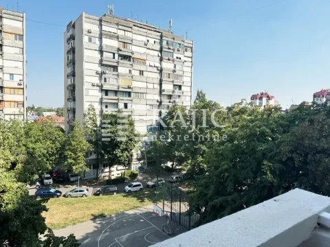 View from the terrace of a residential building and green areas. - image 9