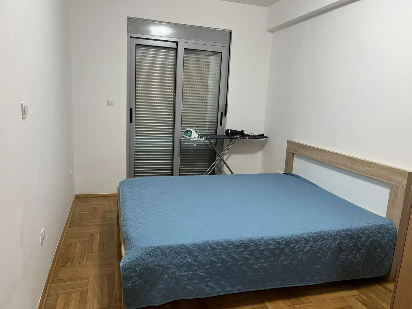 Simple bedroom with a double bed.