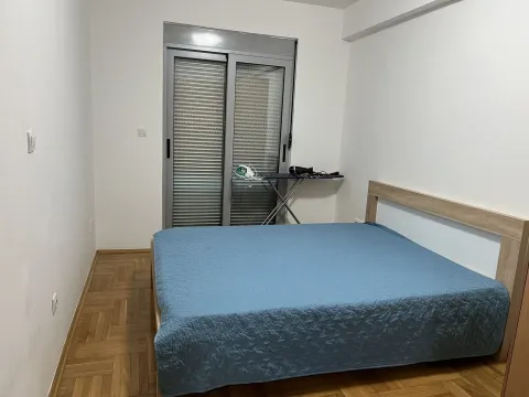Simple bedroom with a double bed. - image 7
