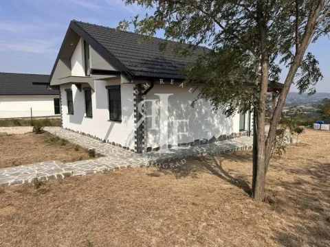 Exterior view of the house with a yard and paved paths. - image 15