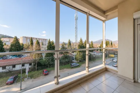 Enclosed balcony with a view of the surroundings and the city. - image 19