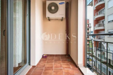 Smaller covered balcony with ceramic tiles and an external air conditioning unit. - image 3