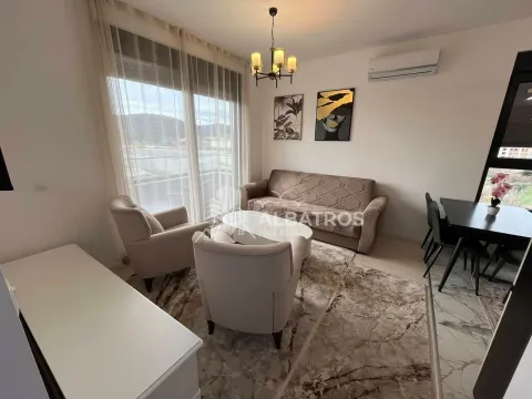 Living room with a sofa, armchairs, and dining table. - image 3