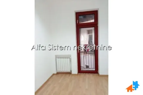 Empty room with laminate flooring and balcony door. - image 7