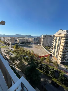 View from the terrace overlooking city streets and surrounding buildings. - image 10