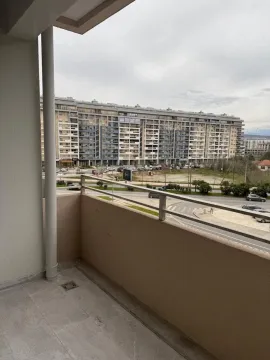 View from the balcony of the neighboring building and street. - image 12