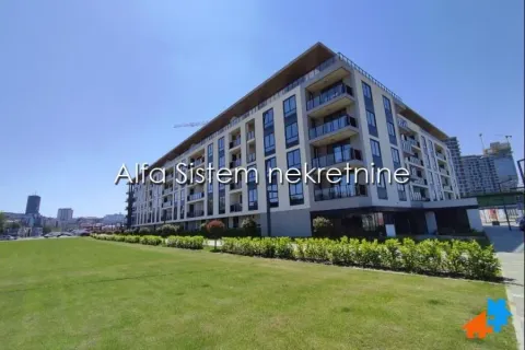 View of the exterior of a modern residential building with a landscaped lawn. - image 22