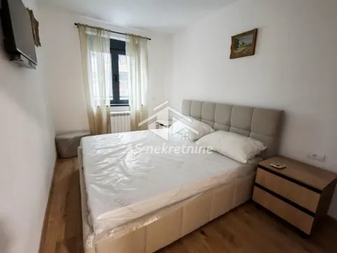 Furnished bedroom with a double bed and a bedside table. - image 25