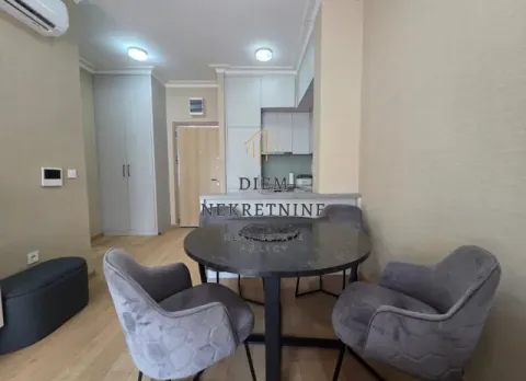Living room with dining area and kitchen in the background. - image 4