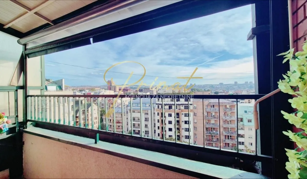 View of the city from a covered terrace.