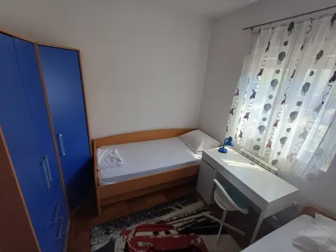 Children's bedroom with a bed, desk, and wardrobe. - image 11