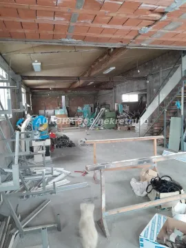 Unfinished space under construction with building materials and tools. - image 4