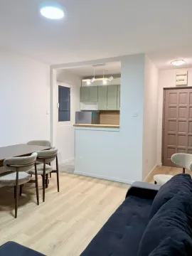 Living room with dining area and open kitchen. - image 11