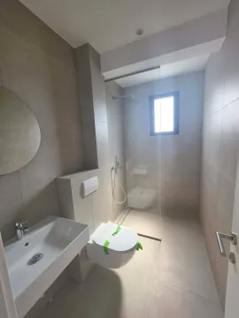 Modern bathroom with a walk-in shower and sanitary ware. - image 7