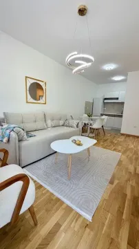 Living room connected to the dining area and kitchen. - image 2