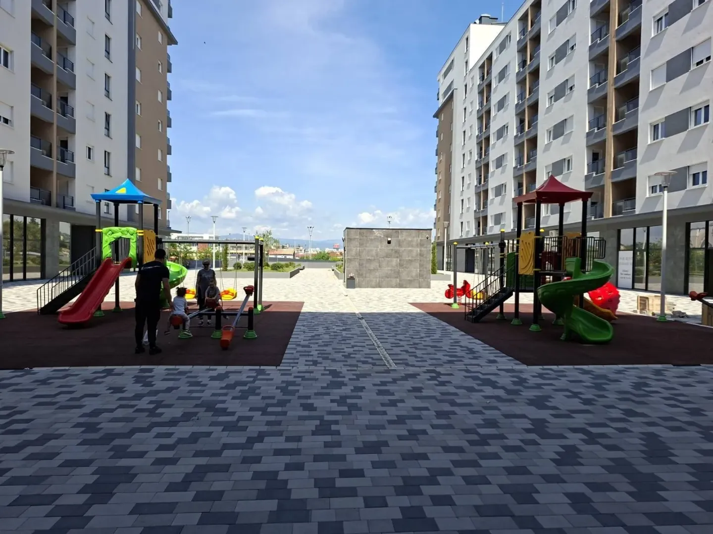 Courtyard of a residential complex with a playground.