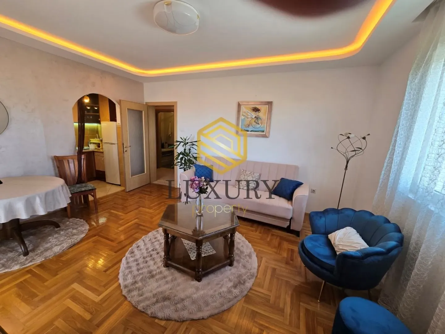 Spacious living room with seating area and dining space.