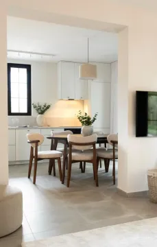 Modern dining area connected to the kitchen and living room. - image 17