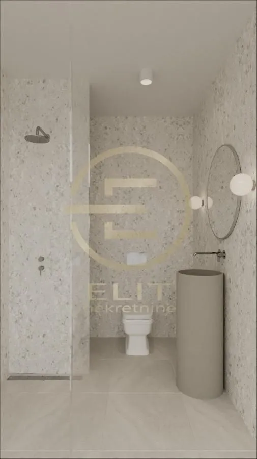 Modernly equipped bathroom with a walk-in shower and a washbasin.