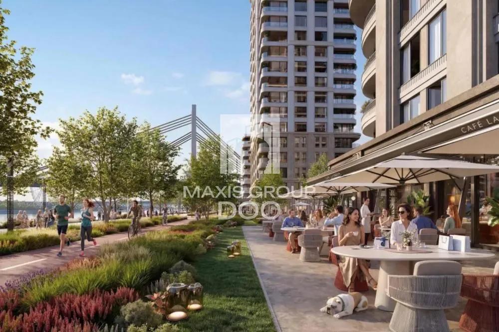 View of the promenade, surrounding buildings, and people enjoying outdoors.