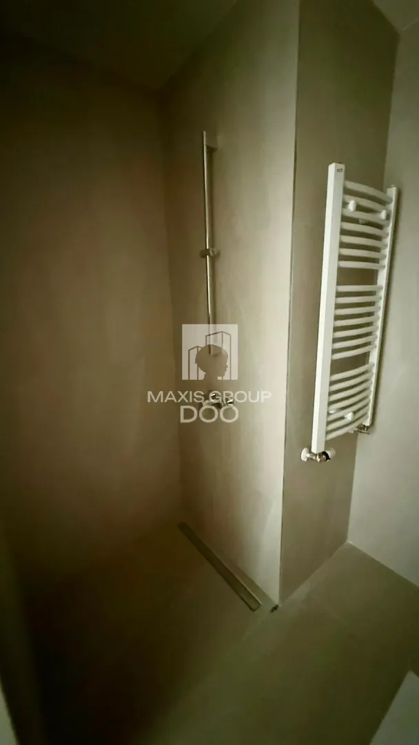 Modernly equipped bathroom with a walk-in shower.