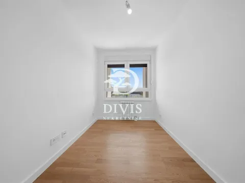 Empty room with white walls, wooden floor, and a window. - image 5