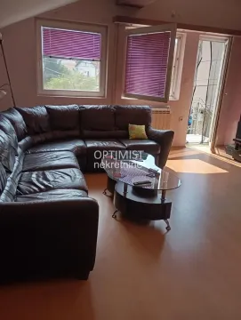 Living room with a sectional sofa and access to the terrace. - image 2