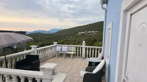 Spacious terrace with seating furniture and a view of nature. - image 3